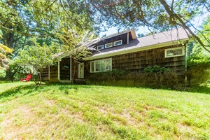 A storybook stream front retreat on nearly 17 acres of complete privacy, this enchanting three bedroom, one bath home offers a serene escape surrounded by nature.
