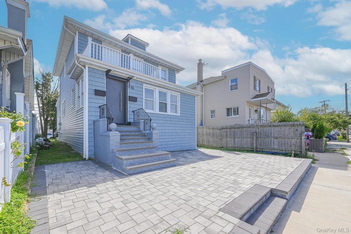 Rear view of property featuring a patio