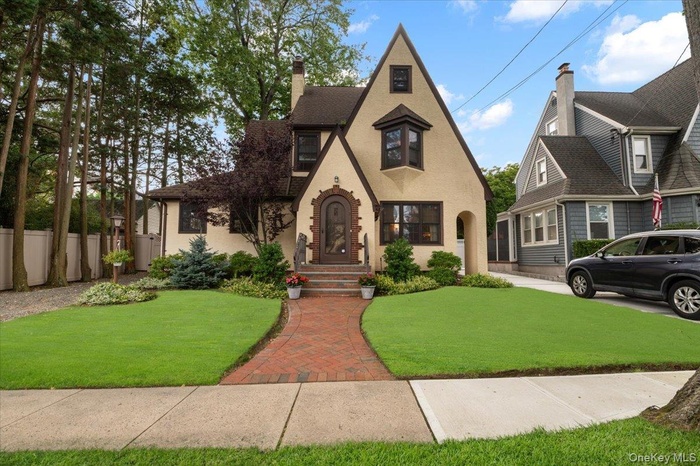 English style home featuring a chimney