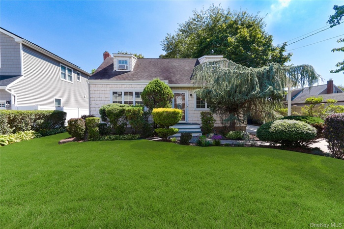 Front View Of Home*Mature Trees *Private Driveway with attached carport