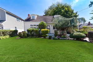 Updated Four Bedroom Cape Featuring EIK Kitchen W Gas Cooking Stainless Steel Appliances Quartz Counter Tops Kitchen Island Two Full Designer Updated Bathrooms Primary Bedroom On 1st Floor Two Large ...