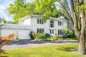 Prestigious Revelstoke Estate Expansive Lot Fully Renovated Stately all white brick 4 bedroom 4 bathroom home in the coveted Revelstoke community that blends timeless elegance with top to bottom renovations ...