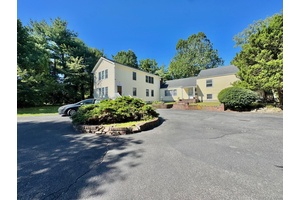 The Property Features Excellent Signage, Great Exposure, High 8 Ceilings, R40 Zoning, 32 Parking Spaces, 2 Car Garage, Skylight, 2 Bay Warehouse, Circular Driveway, 3 Br.