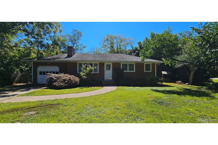Large ranch-style house offers 2 bedrooms, 1 full bath with basement & garage