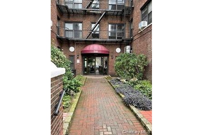 Doorway to property with brick siding
