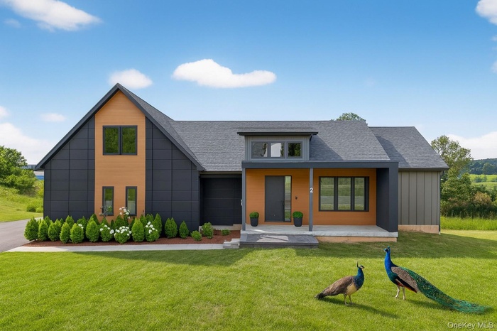 View of front facade with covered porch, a front yard, roof with shingles, and board and batten siding