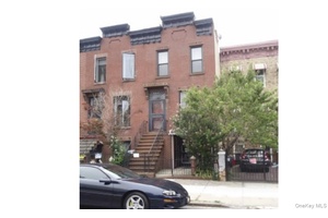 2 Story Large 2 Family Brick, attached House.