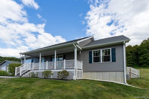 Nestled on a gracious 4. 38 acre parcel distinguished by privacy and gentle slopes, this impeccably crafted ranch home exemplifies modern comfort and understated elegance.
