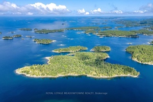 CAMPBELL ISLAND A LEGACY PROPERTY 25 acre island located in north Sans Souci, Campbell Island is divided into 5 legally severed 5 acre lots plus right of way.