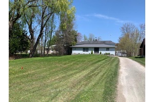 Discover the charm of this waterfront home, perfectly nestled along a serene canal with direct access to picturesque Lake Simcoe.
