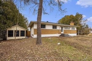 REDUCED PRICE ! BUNGALOW WITH IN LAW SUITE ON NEARLY ONE ACRE AT AN INCREDIBLE PRICE !