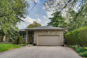 Extremely Well Maintained Large Bungalow With In Law Suite amp ; Double Car Garage On A Quiet Cul De Sac Siding Onto Green Space.