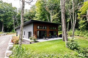 Introducing a one of a kind Smart Home completed in 2023, designed for low maintenance living and energy efficiency.