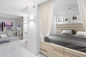 Glamorous extra large studio adorned with beautiful details, flooded with sunlight, perfectly renovated, and offered completely furnished.
