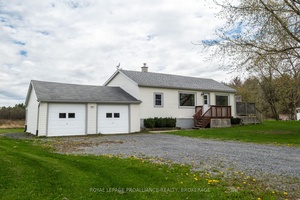 Welcome to 5426 Battersea Road a delightful country bungalow combining rustic charm amp ; functionable living, nestled in the serene landscape of South Frontenac.