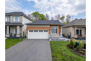 Newer double car garage, bungalow for sale in Orleans.