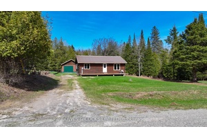 Welcome to 146 Rusaw Road, a delightful 2 bedroom log home nestled on a generous 1.
