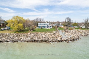 Welcome to 477 Stone St This custom built open concept executive home features a pristine 100 ft lake frontage.