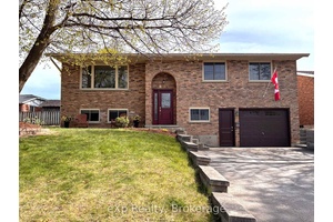 Located on a quiet street in a desirable neighborhood, this well maintained raised brick bungalow blends comfort and convenience and close to many amenities.