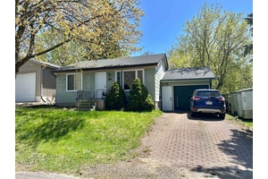 Check out this updated two bedroom bungalow with an attached garage.