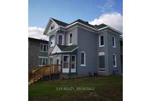 Versatile 2 Storey Property with Commercial Zoning Grandfathered Residential Use.