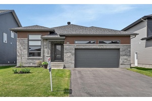 OPEN HOUSE SUNDAY JULY 13TH 2 4PM Welcome to this stunning three bedroom bungalow, offering approximately 1, 700 sq.