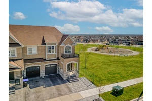 Welcome to this spacious 4 bedroom, 3 bathroom end unit townhouse, attached to the neighboring home only by the garage and a single bedroom wall on the second floor, offering ...
