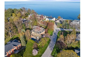 A masterclass in scale and proportion, this custom built residence is quietly positioned on 1 2 acre in one of South East Oakville's most prestigious and tranquil enclaves.