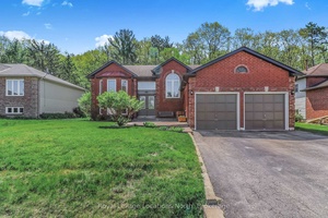 BACKING ON TO DESIGNATED GREENSPACE Fantastic location with nothing but mature trees and forest behind this well maintained 4 bedroom, 2 bathroom raised bungalow.