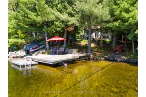 Nestled on the shores of Muskoka's Lake of Bays, this beloved four season cottage has been cherished by the same family for decades a true legacy of laughter, connection, and ...