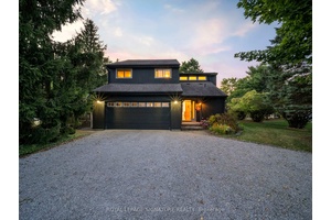 Welcome to your dream retreat at 6 Petherwin Place, nestled on the serene shores of Bass Lake !