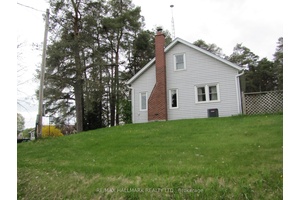 1. 2 acres Treed land. Close Proximity To Gas Station, Shops And Other Amenities with main street exposure.