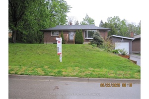 Welcome to this tastefully updated all brick raised bungalow.
