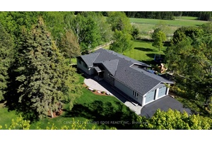 Experience the charm of this fully customized raised bungalow country estate, thoughtfully designed for luxurious and comfortable living.