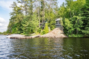 This 4 bedroom Kahshe Lake cottage is uniquely designed and just waiting for a new owner to put their stamp on it.