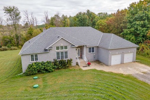 Located on over 11 acres of welcoming landscape that features trails, wooded sections, and picturesque views, this custom built, all brick bungalow has been carefully maintained by its original owners, ...