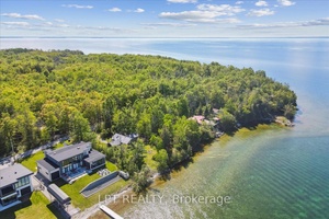 Gorgeous log cabin waterfront on Lake Simcoe on leased land within 1 hour from Toronto and the GTA.