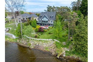 Welcome to this stunning, 10 year old executive waterfront home on the Bay of Quinte, where modern comfort meets secluded elegance.