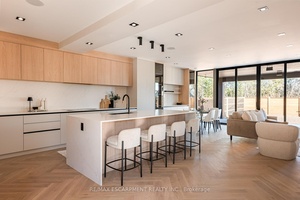 Step into this architecturally striking luxury residence, expertly crafted by Montbeck Developments, where exceptional design and meticulous craftsmanship span all three levels.