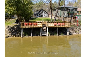 Experience Tranquil Riverfront Living in Wasaga Beach.