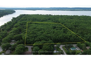 15. 7 acres of well drain mature forest lot, zoned for residential building and an accessory building.