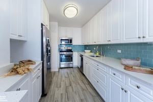 This spacious and move in ready two bedroom, two bathroom home at the luxurious Winston Churchill offers an ideal combination of style, comfort, and convenience.