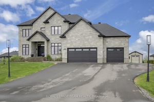Nestled on a generous half acre lot in the prestigious community of Greely, in Ottawa's desirable south end, this stunning custom built 2 storey home with a fully finished basement ...