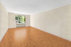 Unit 1CW at Chelsea Gardens is a pre war one bedroom apartment, elevated above the garden, that feels like it's on the second floor.