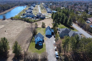 This two storey renovated country home with a detached large heated home based workshop situated on a spacious private half acre lot features three generously sized bedrooms and two full ...