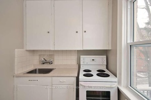 Old South Character Two Bedroom The top floor of this century home features a bright and sunny upper two bedroom with balcony.