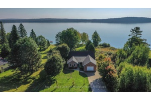 Fabulous recreational residence on private level lakefront on beautiful, clean Lake Bernard.