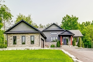 Set On A Serene amp ; Private Half Acre Lot In Desirable Minesing, Just Minutes From Snow Valley Ski Resort, This Custom Modern Bungalow Offers A Rare Blend Of Sophistication, ...