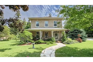 Timeless Yellow Brick Century Home on a Corner Lot Full of Charm, Character, and Curb Appeal !