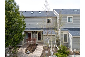 This remarkable condo townhome is located in Living Stone Community formerly Cranberry close to waterfront, trails, golf, beaches and ski hills.